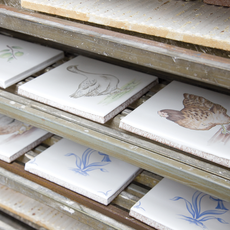 hand painted white tile with duck and hen prints