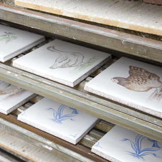 handpainted white tile with duck and hen prints