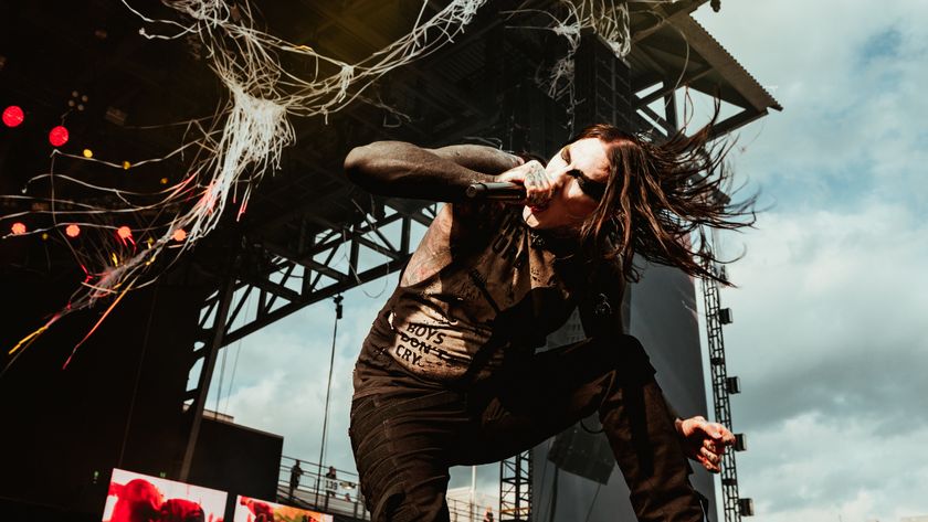 Chris Motionless screaming into a mic on stage