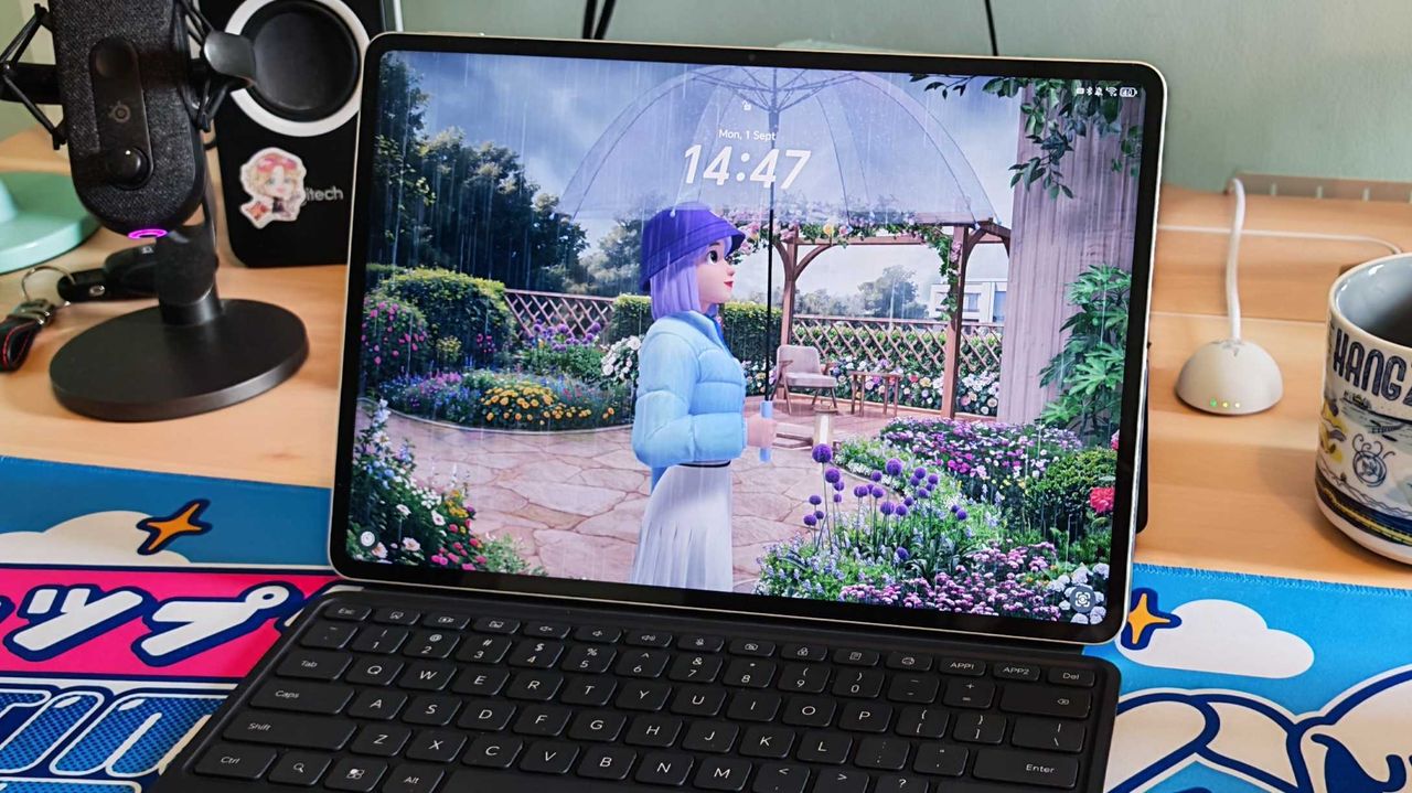 The Honor MagicPad 3 placed on a colorful desk mat.