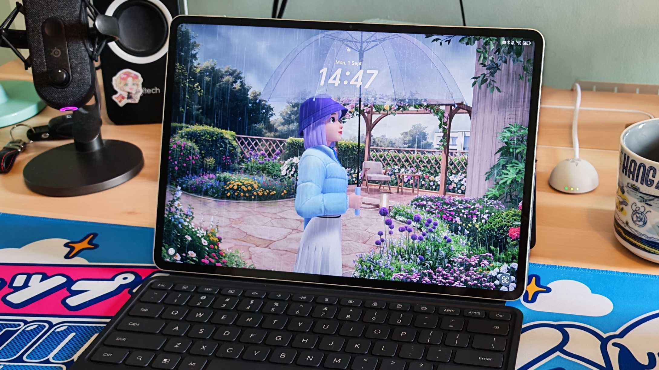 The Honor MagicPad 3 placed on a colorful desk mat.