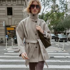 Woman wearing beige jacket