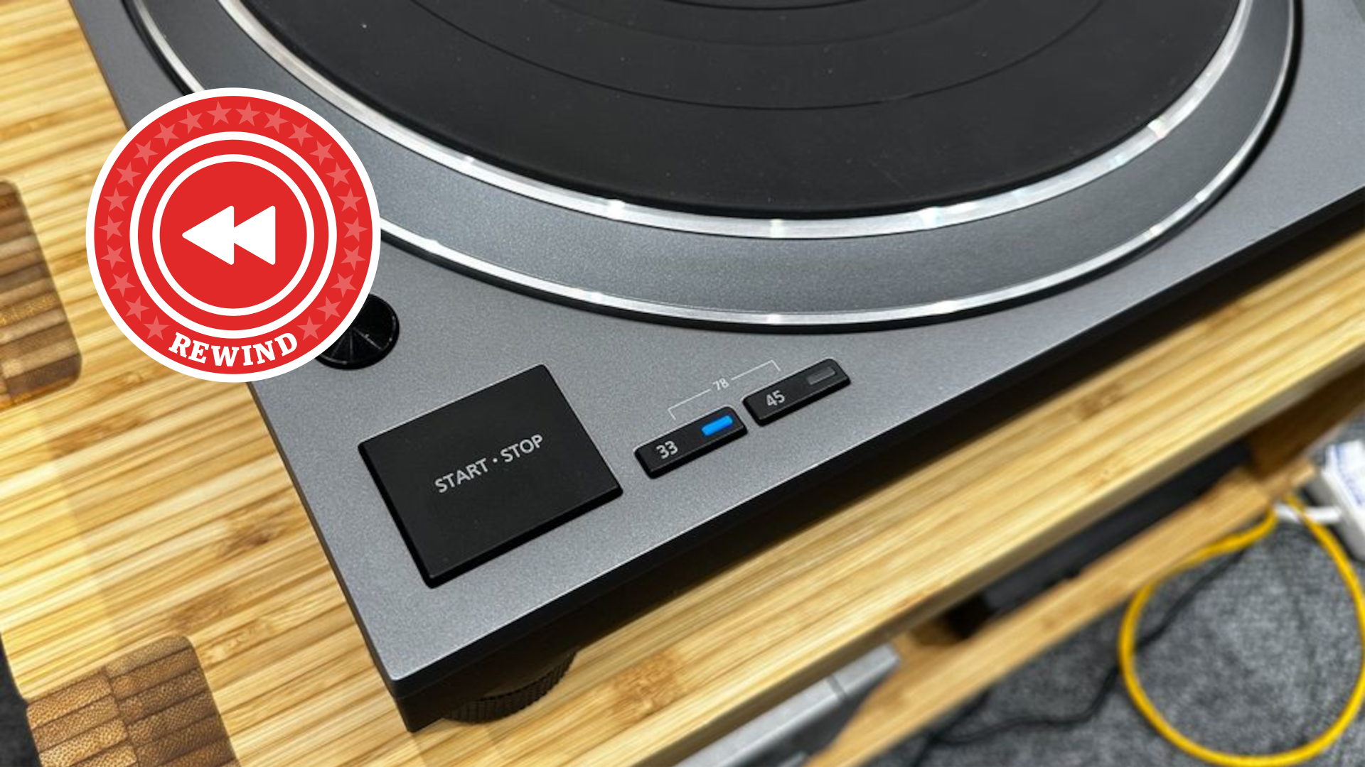 Technics turntable play button with Rewind logo