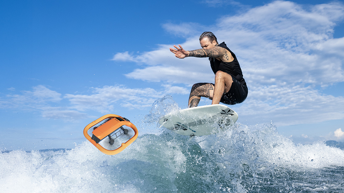 Zero Zero Robotics HoverAir Aqua following a surfer