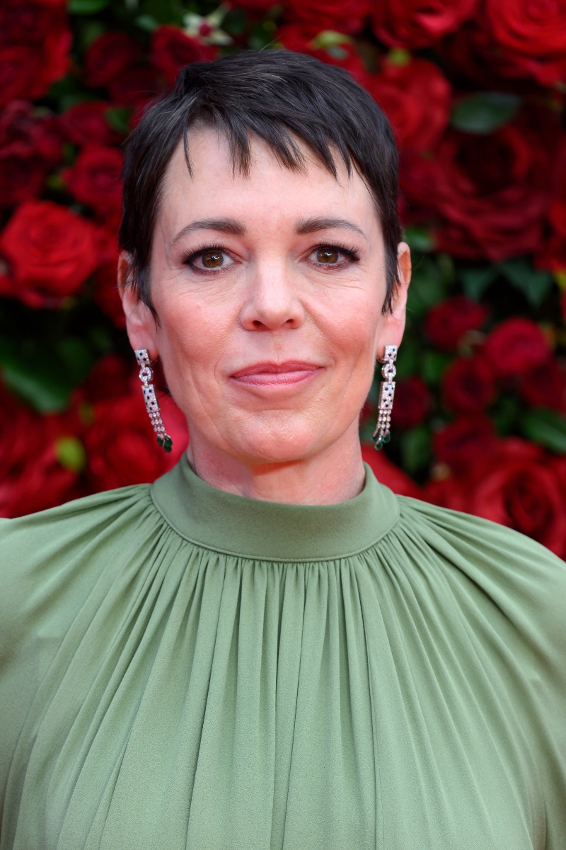 Olivia Colman is pictured with a short pixie haircut and wearing a green dress at &quot;The Roses&quot; UK Premiere at the Odeon Luxe Leicester Square on August 28, 2025 in London, England.