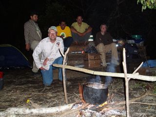 Here the researchers (F. Mayle, J. Carson and J.D. Soto), as well as Bolivian field guides/rangers sit at their campsite in the Bolivian Amazon.
