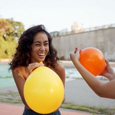 Female having fun with party balloon