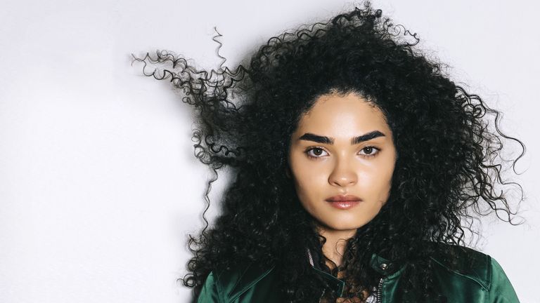 Hairstyle, Sleeve, Jacket, Collar, Style, Jheri curl, Black hair, Ringlet, Cool, Jewellery,