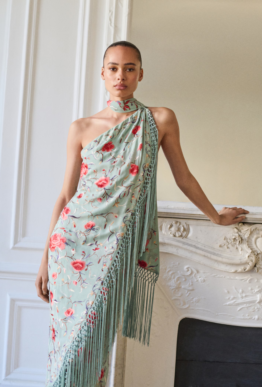 An image of a fringed floral dress from Mango.