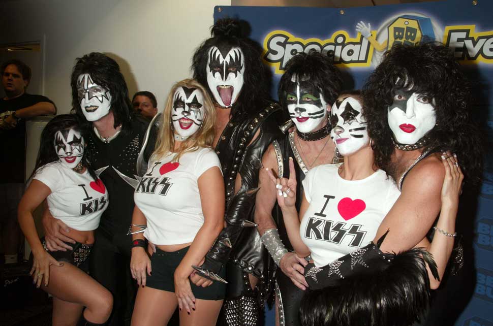 Kiss and fans at a ceremony to receive Gold Record awards for Kiss Symphony: Alive IV