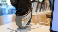 Google Pixel Watch on a charging stand at the Google Fall 2022 event