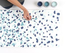 painting a DIY terrazzo tabletop