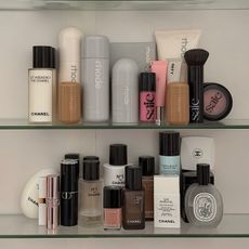 Photo of skincare and makeup products on a bathroom shelf