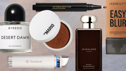 Product collage of makeup by mario setting powder, huda beauty easy blur foundation, byredo desert dawn perfume, therabody depuffing wand, victoria beckham beauty concealer pen, and jo malone london hinoki &amp; cedarwood cologne over beige and blue gradient background 