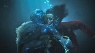(L to R) Doug Jones as The Asset and and Sally Hawkins as Elisa kiss underwater in The Shape of Water