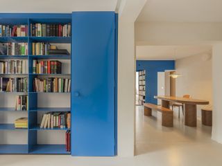 digital blue bookshelves in a neutral open plan space
