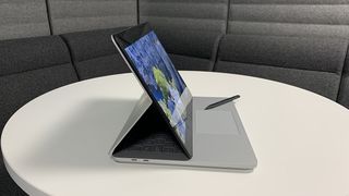 A side view of the Surface Laptop Studio 2 in mid-point between laptop and tablet form.