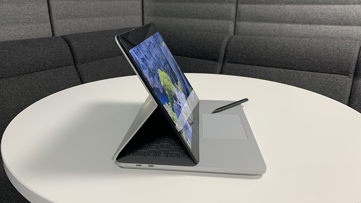 A side view of the Surface Laptop Studio in mid-point between laptop and tablet form.