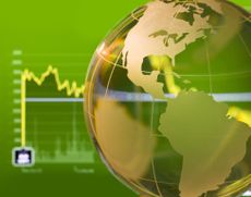 Glass globe over stock data on computer screen, global stocks concept