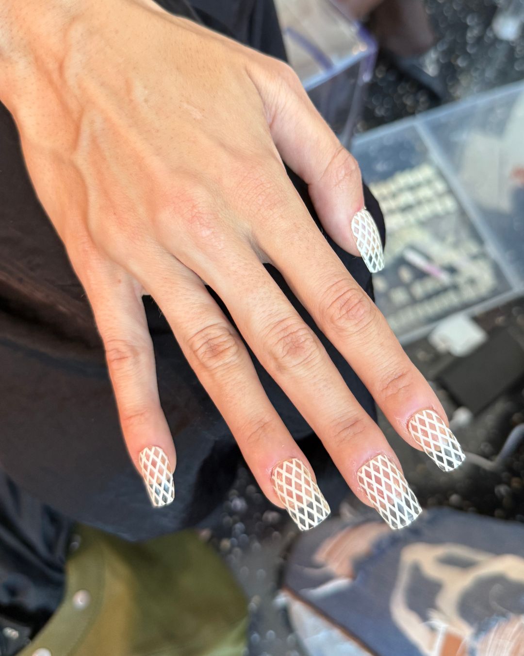 An image of the fishnet nails backstage at Kim Shui spring/summer 26.