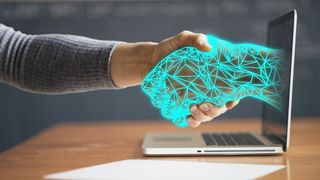 Person shaking hands with digital hand - AI innovation for the masses