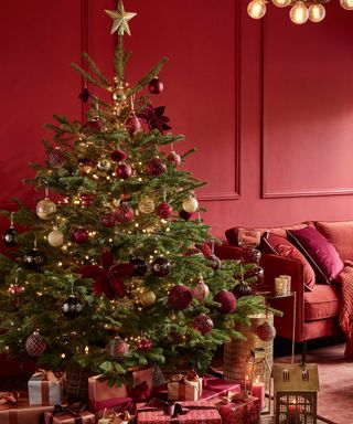 An all-red Christmas decorating scheme in a living room by Dobbies