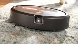 The iRobot Roomba J0+ robot vacuum on a rug