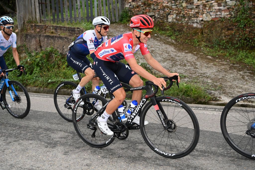 COLLU FANCUAYA SPAIN AUGUST 27 Remco Evenepoel of Belgium and Team QuickStep Alpha Vinyl Red Leader Jersey competes during the 77th Tour of Spain 2022 Stage 8 a 1534km stage from Pola de Laviana to Collu Fancuaya 1084m LaVuelta22 WorldTour on August 27 2022 in Collu Fancuaya Spain Photo by Justin SetterfieldGetty Images