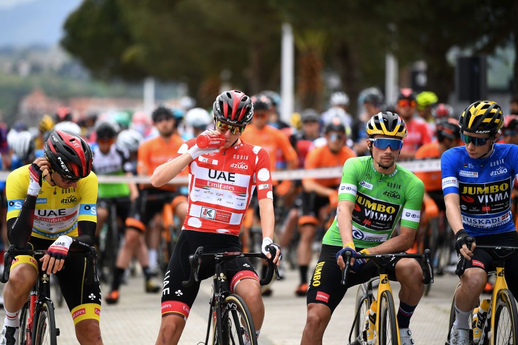 ONDARROA SPAIN APRIL 09 Start Brandon Mcnulty of United States and UAE Team Emirates Yellow Leader Jersey Tadej Pogacar of Slovenia and UAE Team Emirates Polka Dot Mountain Jersey Primoz Roglic of Slovenia and Team Jumbo Visma Green Points Jersey Jonas Vingegaard Rasmussen of Denmark and Team Jumbo Visma Blue Best Young Rider Jersey during the 60th ItzuliaVuelta Ciclista Pais Vasco 2021 Stage 5 a 1602km stage from Hondarribia to Ondarroa itzulia ehitzulia on April 09 2021 in Ondarroa Spain Photo by David RamosGetty Images