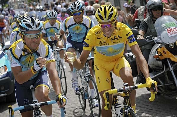 Alberto Contador enjoys some champagne with his Astana teammates.