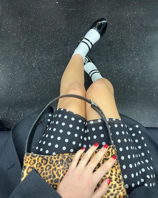 olivia rodrigo wears a polka dot dress and leopard bag on the subway in nyc