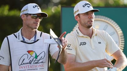Travis Perkins consults with Sam Burns at the 2022 Arnold Palmer Invitational