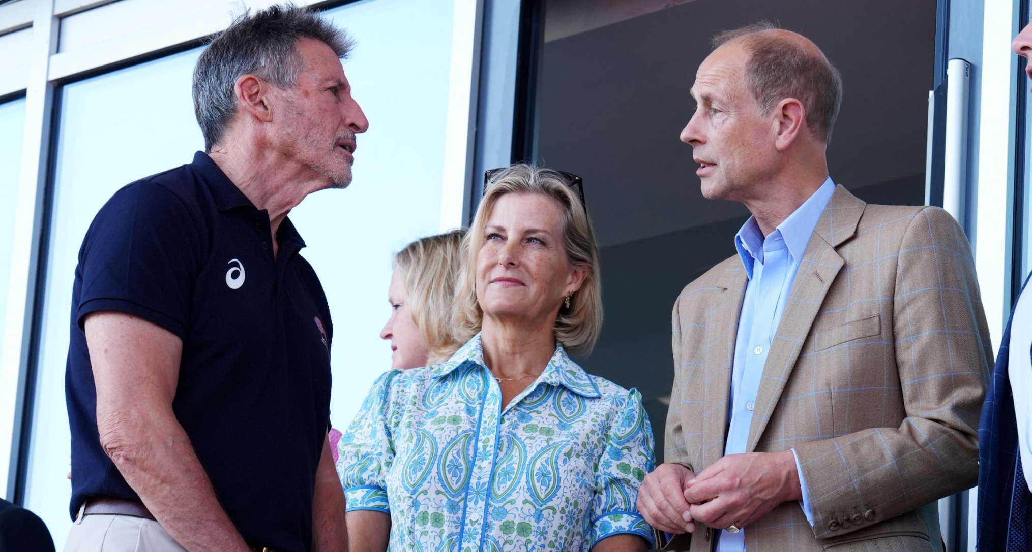 Duchess Sophie standing next to Prince Edward in a blue dress