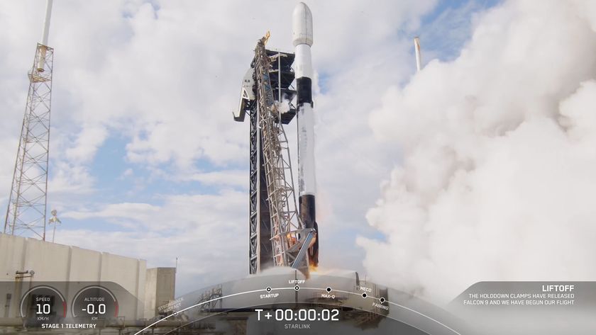 A white and black SpaceX rocket launches into a blue sky with clouds on Feb. 11, 2025.