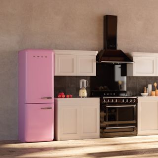 Smeg pink fridge in a neutral kitchen with wooden floors