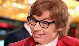 Austin Powers: International Man Of Mystery smiling at a casino table