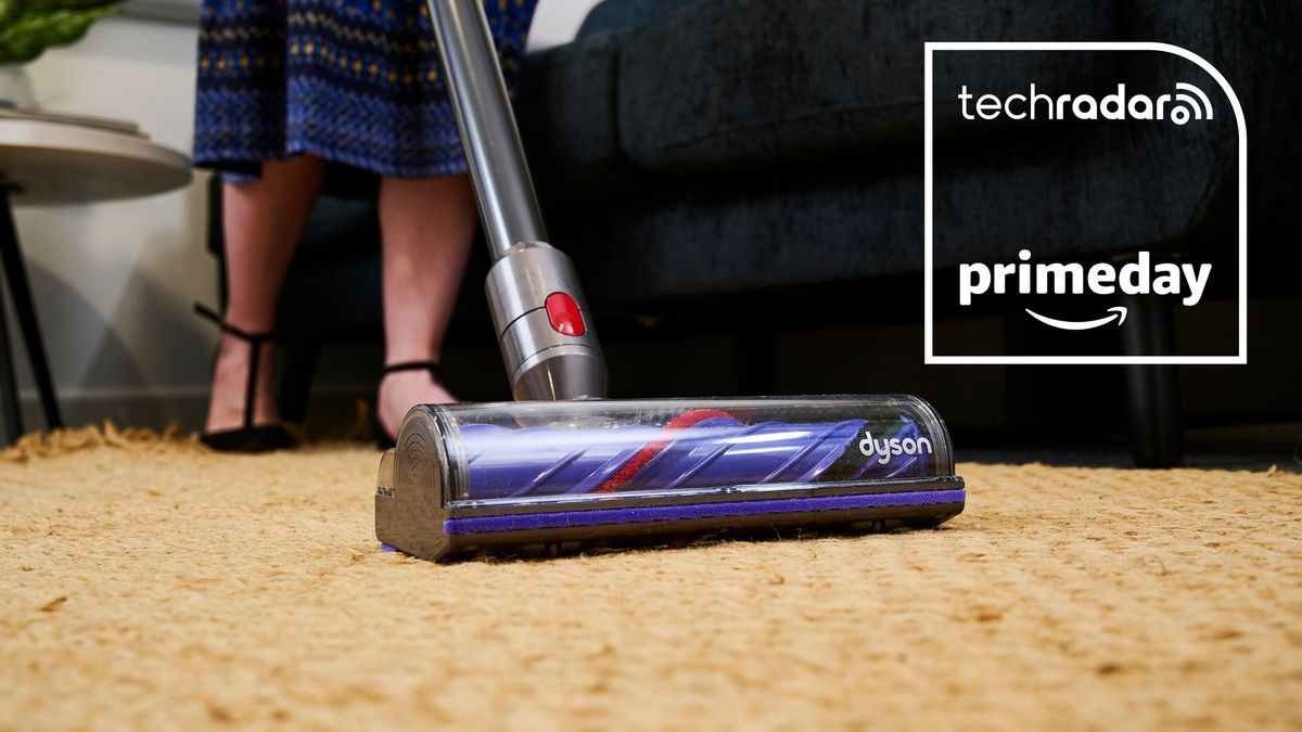 Close up of Dyson V8 vacuum floorhead on a rug, with Prime Day graphic overlaid