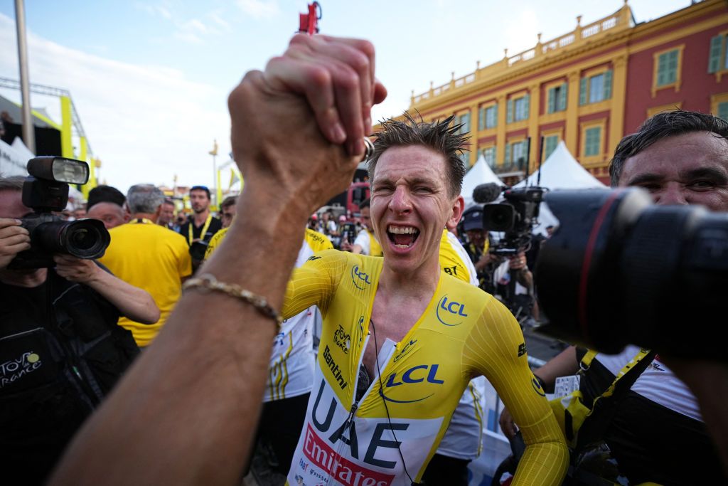 UAE Team Emirates team&#039;s Slovenian rider Tadej Pogacar wearing the overall leader&#039;s yellow jersey celebrates his overall victory after the 21st and final stage of the 111th edition of the Tour de France cycling race, a 33,7 km individual time-trial between Monaco and Nice, on July 21, 2024. (Photo by Laurent Cipriani / POOL / AFP)