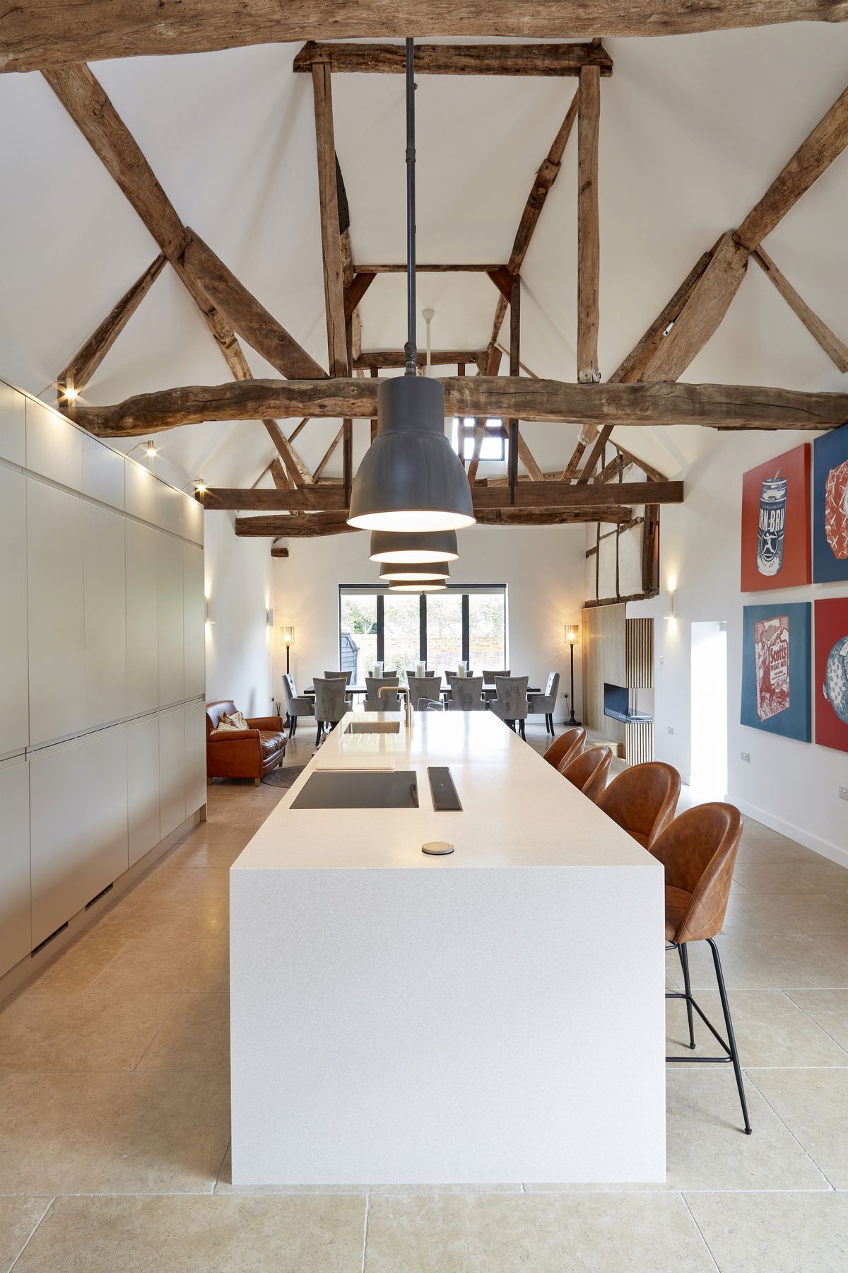 white open plan kitchen and dining area in large barn conversion