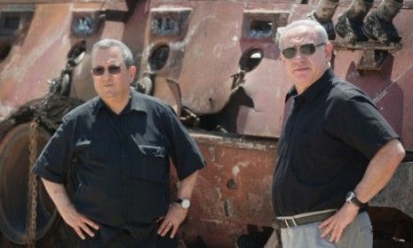 Israel&amp;#039;s defense Minister Ehud Barak with Israeli Prime Minister Benjamin Netanyahu in August in Kerem Shalom, Israel. Barak announced Monday that he would step down in January. 