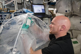 ESA astronaut Alexander Gerst works on the MICS experiment aboard the International Space Station. This experiment aims to show how cement forms in space, as researchers think that cement and concrete-like mixtures could one day be used to build habitats on the moon and Mars.