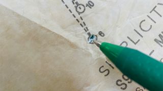 How to sew beginners; a close up of a pen and sewing pattern
