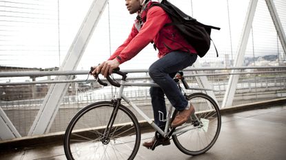 Man riding a bike in an urban environment