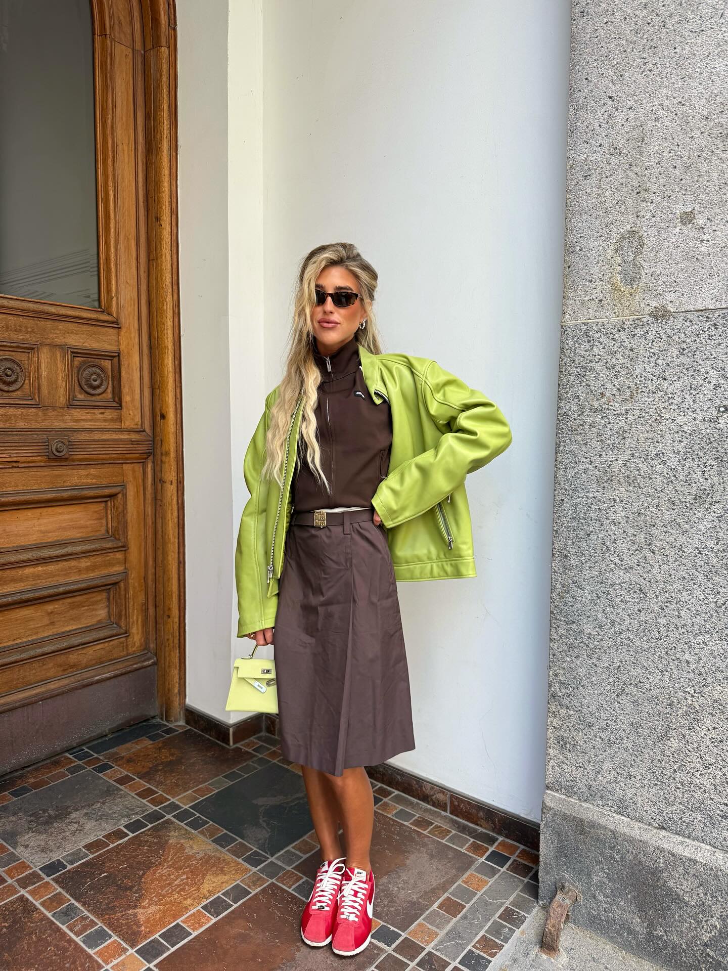 An image of @emilisindlev wearing colourful red trainers from Nike x Jacquemus.