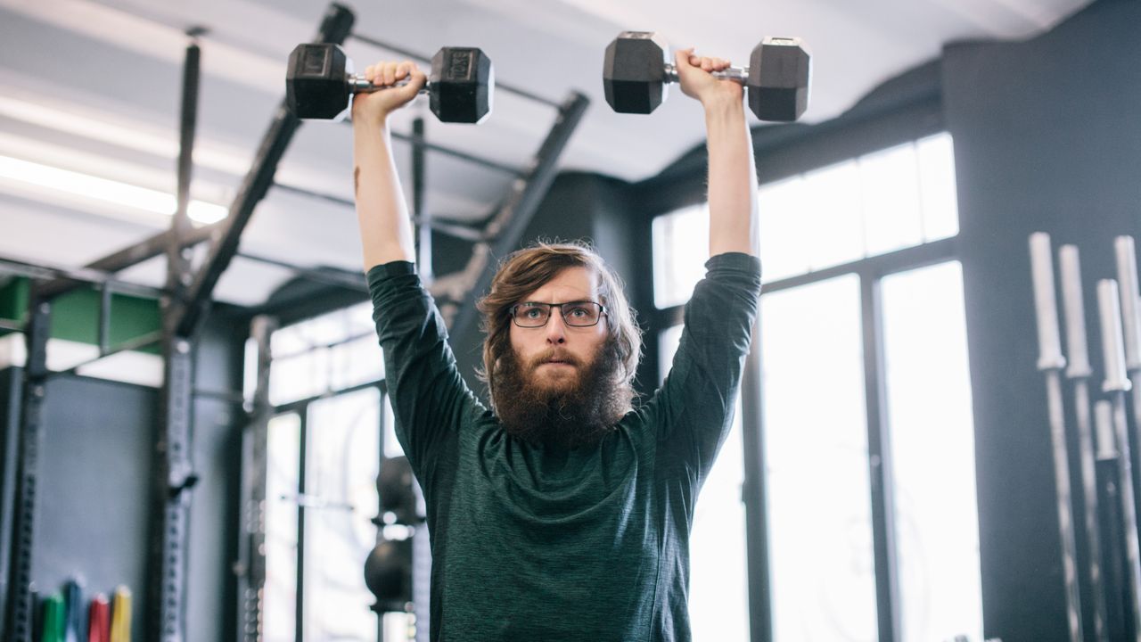 Man exercising with dumbbells