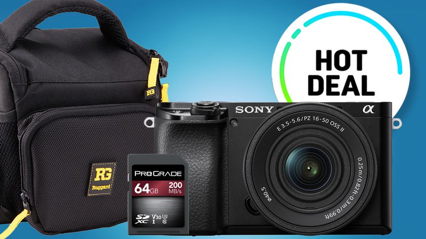 A Sony a6100 camera and 64GB ProGrade SD card are displayed alongside a black camera bag, highlighted by a &quot;Hot Deal&quot; sticker