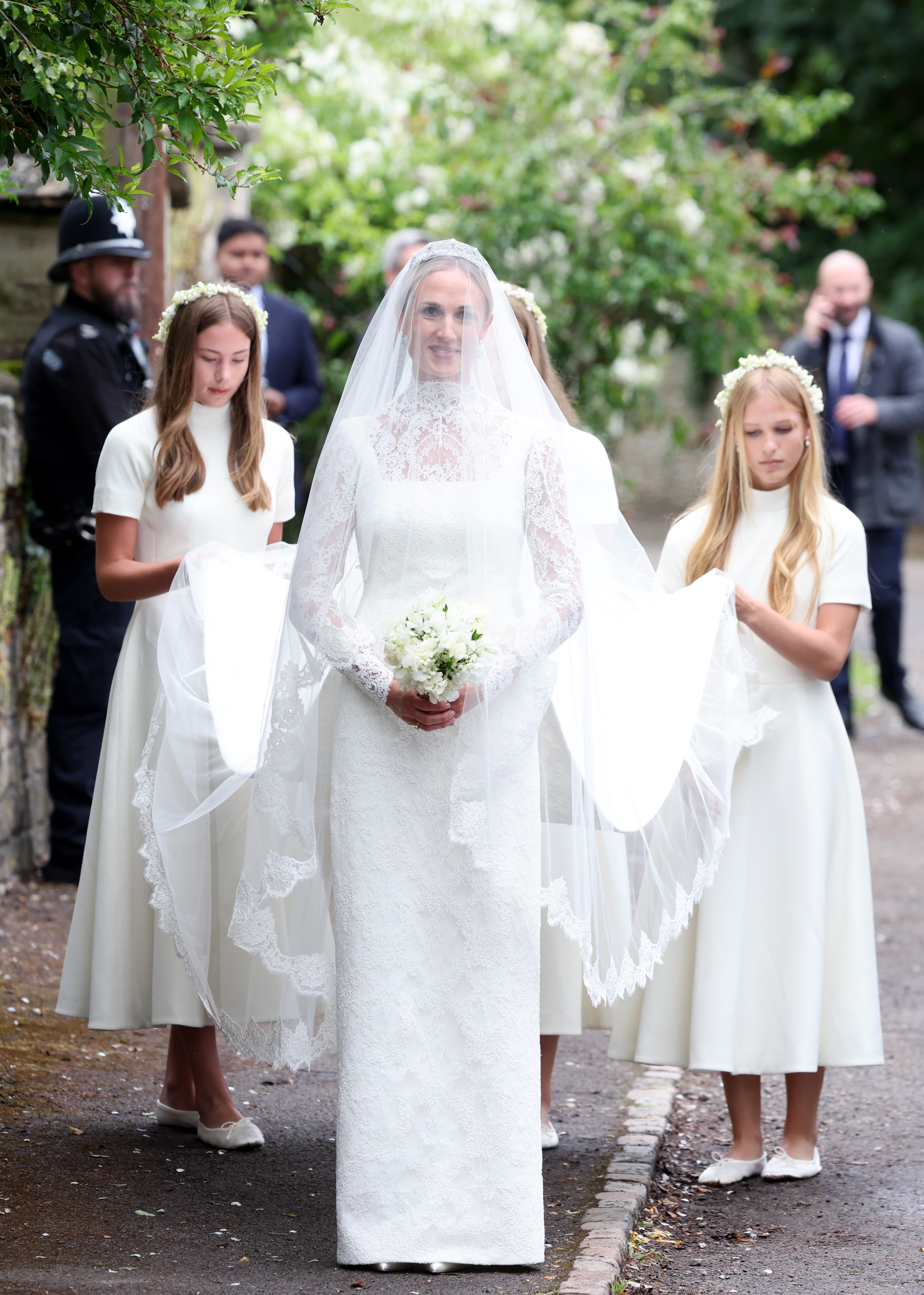 Harriet Sperling followed by her bridesmaids Georgina Sperling, Savannah Phillips and Isla Phillips for the Royal wedding of Peter Phillips and Harriet Sperling at All Saints' Church on June 06, 2026