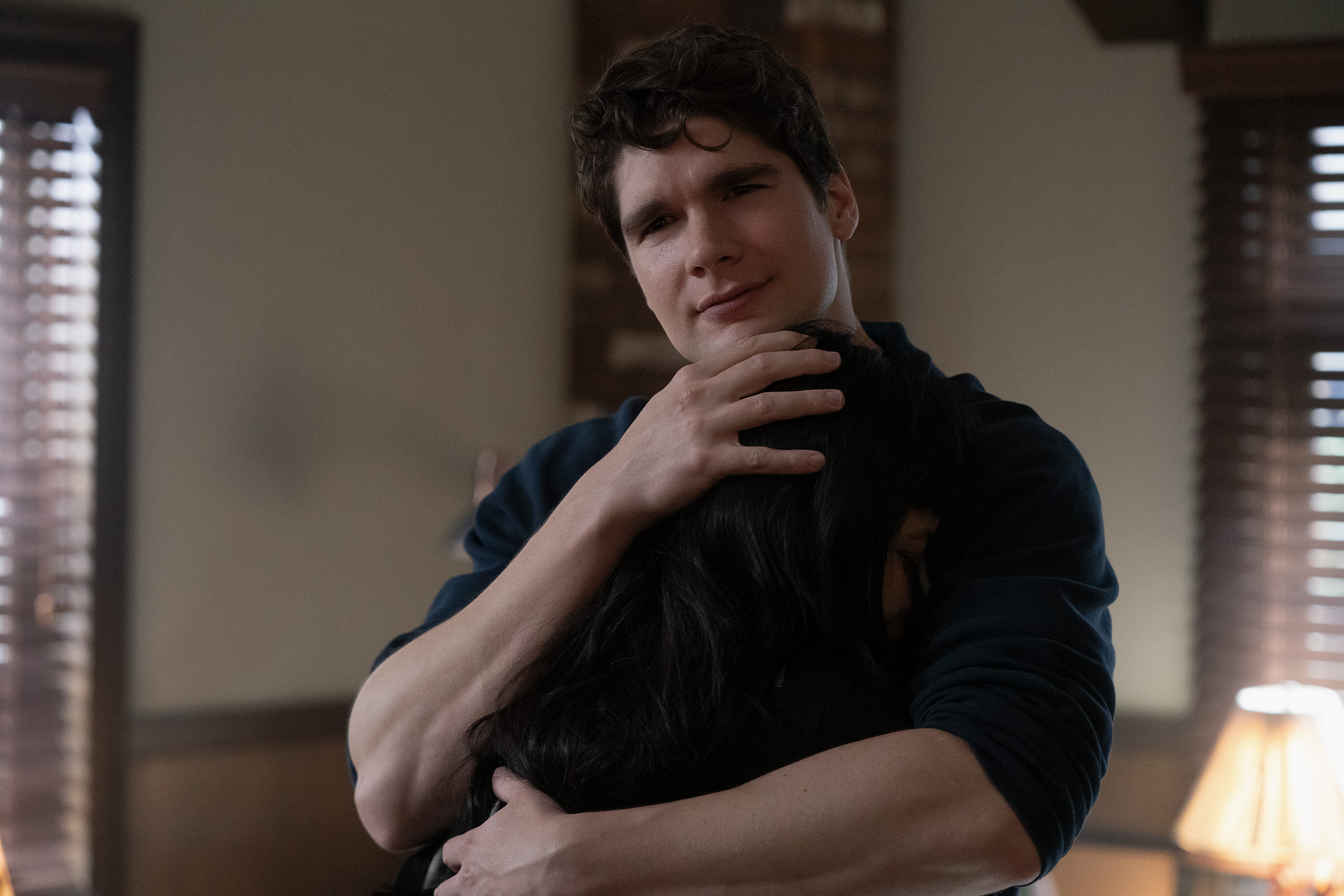 spencer house as wrigley embracing a girl as she cries into his arm in a dorm room in the tell me lies season 3 finale