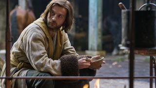Andrew Gower holding a bowl as Sansum in The Winter King.