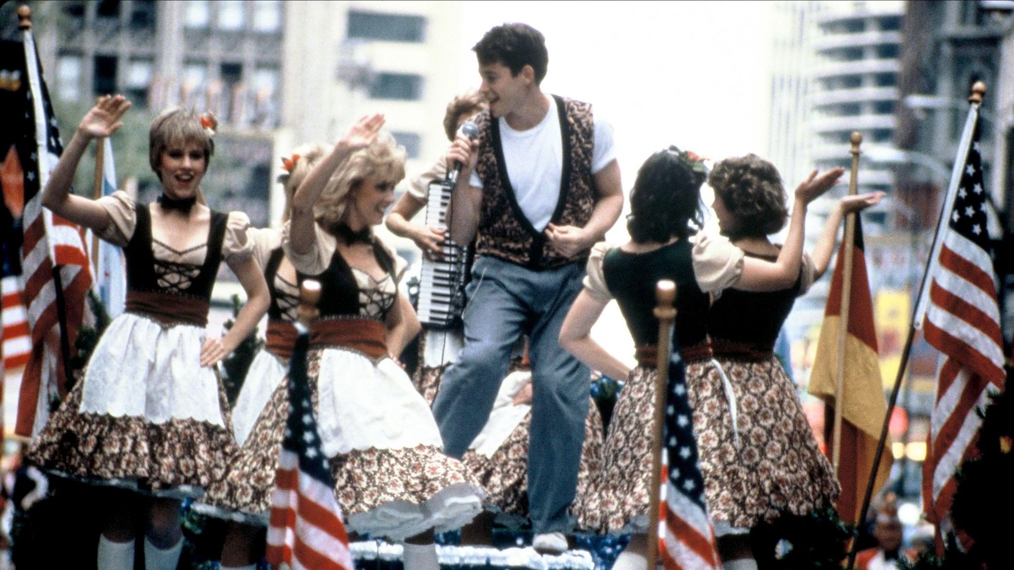 Matthew Broderick as Ferris Bueller singing on a parade float in Ferris Bueller's Day Off